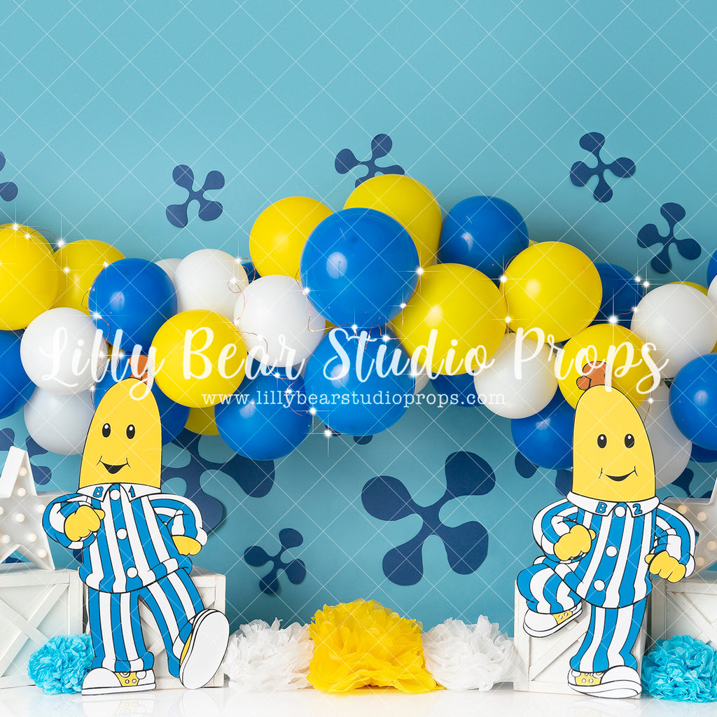 Bananas and their Pyjamas - Lilly Bear Studio Props, balloon, balloon arch, balloon garland, bananas, blue, flowers, white balloon arch, white balloons, yellow, yellow and blue