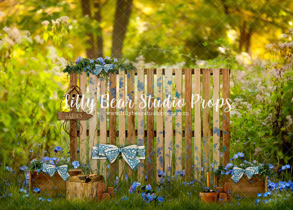 Decorated Forget Me Knot Garden Fence - Lilly Bear Studio Props, blue flowers, cherry, cherry blossoms, colourful rainbow, daisies, daisy, Fabric, FABRICS, floral ladder, floral rainbow, flowers, heart, hot air balloon, hot air balloons, lace tent, ladder, newborn hot air balloon, pink balloons, pink cherry blossoms, pink flowers, rainbow, rainbow clouds, spring blooms, spring garden, spring ladder, spring ladders, spring rainbow, spring wall, white fence