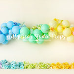 Rainbow Floral Garland - Lilly Bear Studio Props, balloon rainbow, blooming flowers, blue floral, blue flowers, blue rainbow, bright flowers, colours of the rainbow, floral, floral arch, floral balloons, pastel, pastel balloon garland, pastel balloon wall, pastel balloons, pastel blue, pastel green, pastel orange, pastel pink, pastel purple, pastel rainbow, pastel wall, pastel yellow, rainbow flowers
