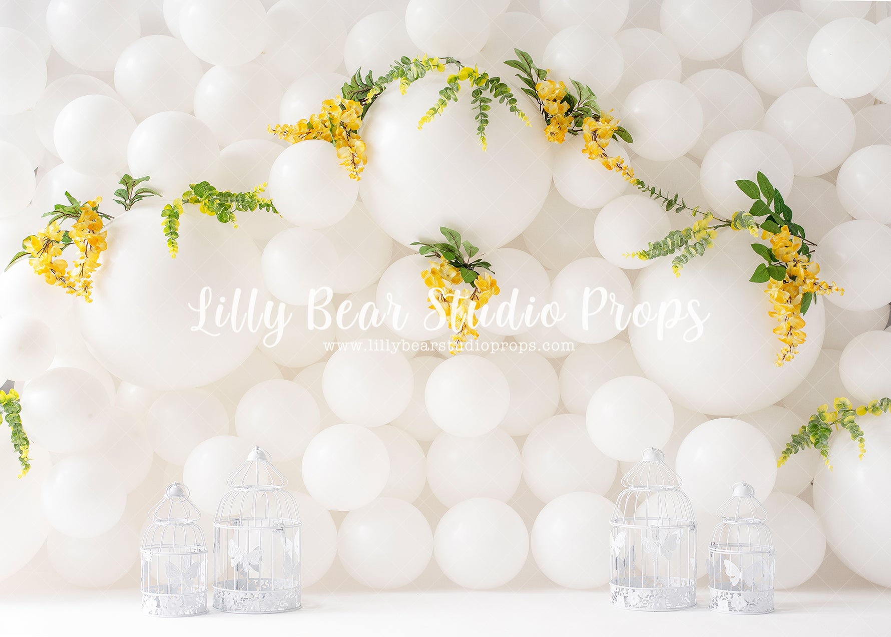 White Spring Balloon Wall - Lilly Bear Studio Props, balloon, balloon chic, balloon flowers, balloon wall, bird cage, bird cages, greenery, spring, spring ballooons, spring floral, spring flowers, white balloon wall, white balloons, yellow floral, yellow flowers